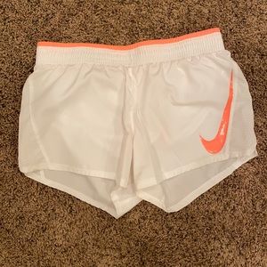 White and pink Nike shorts